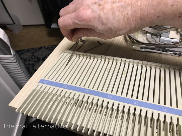 changing the sponge bar in a knitting machine removing needles