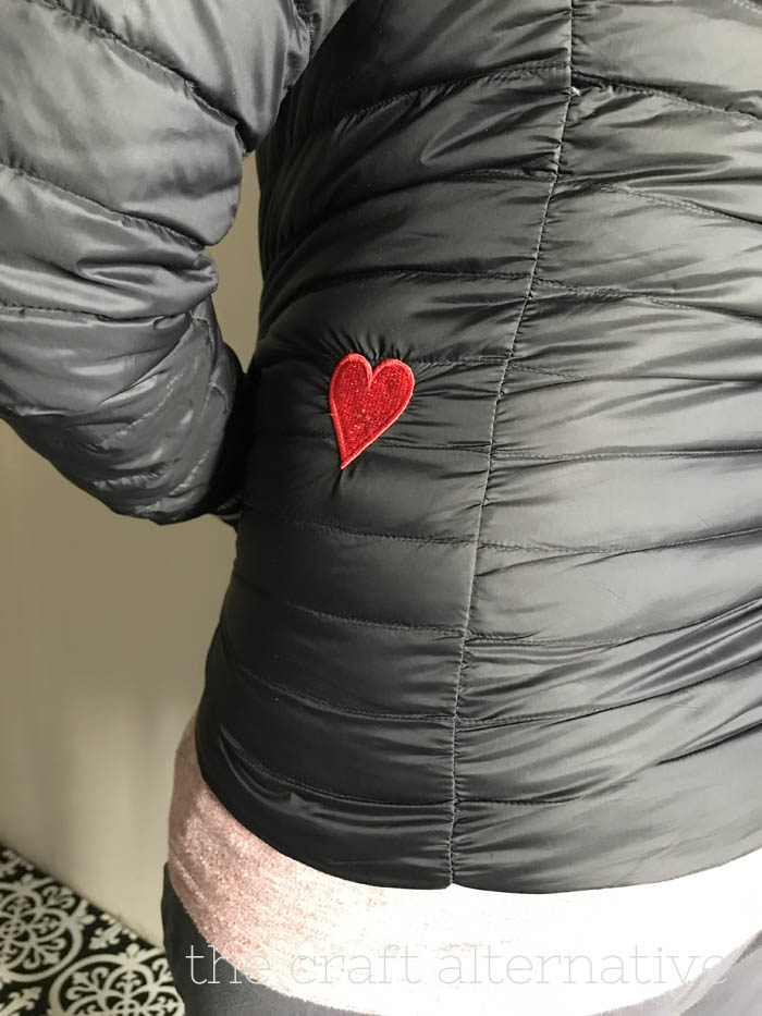 how to repair a tear in a jacket with embroidery finished project